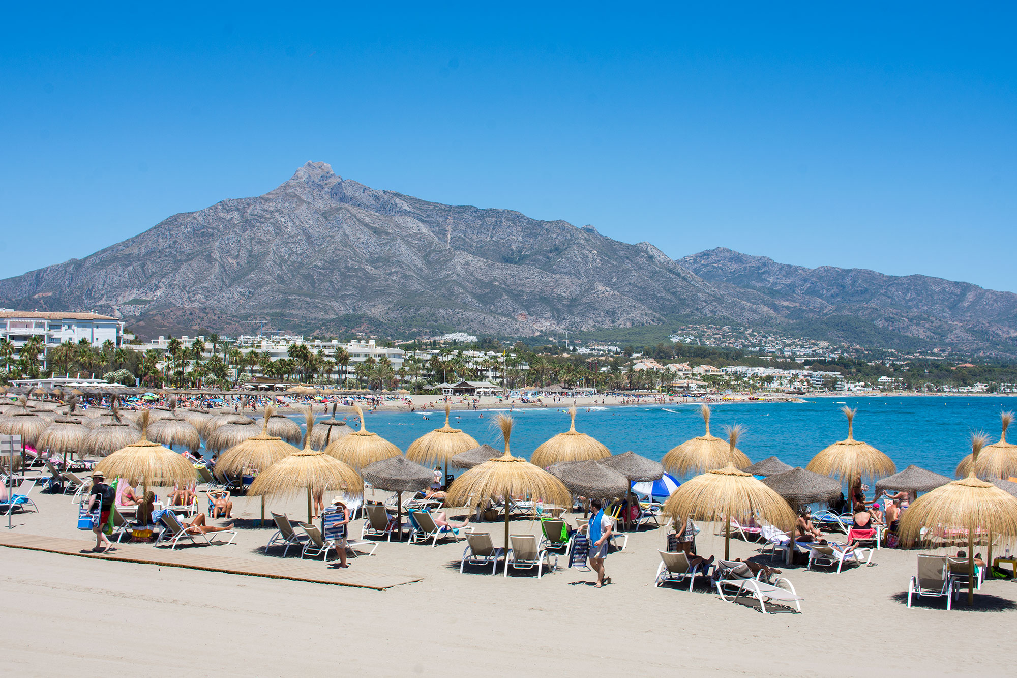 Marbella West vs Marbella East - Puerto Banus Beach on Summer day